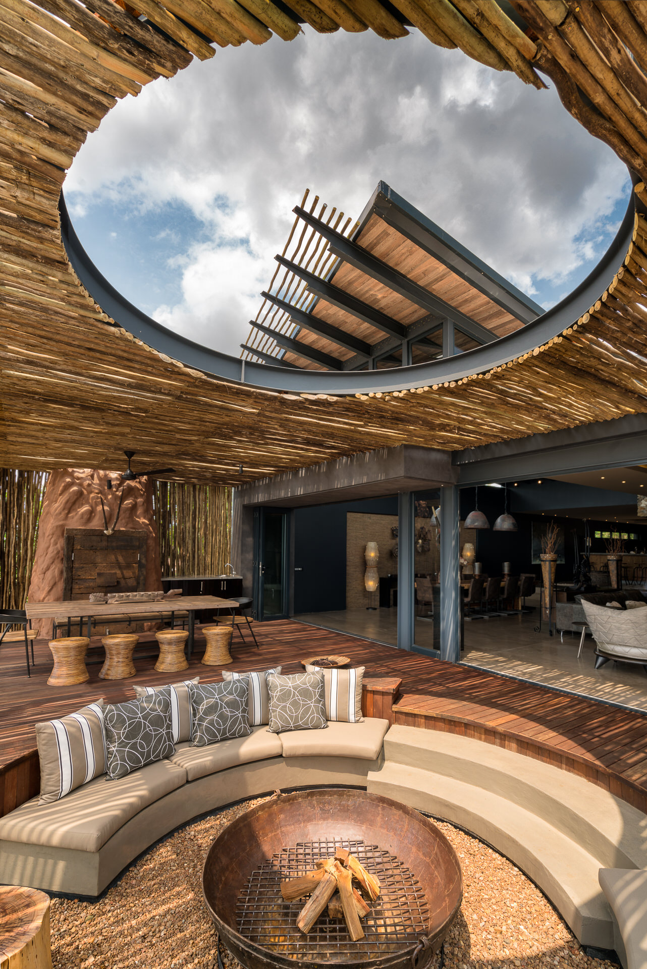 Outdoor patio with boma, dining and pool area