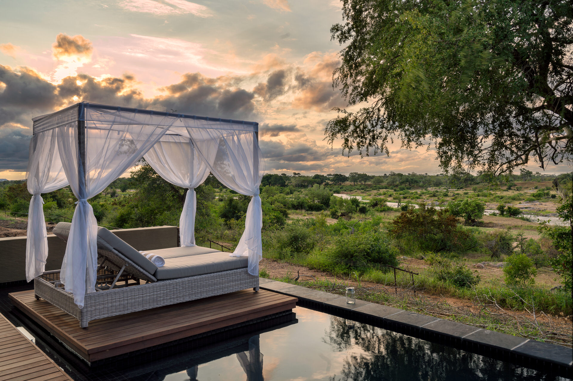 View over pool and day beds at N'Wambu Safari Lodge